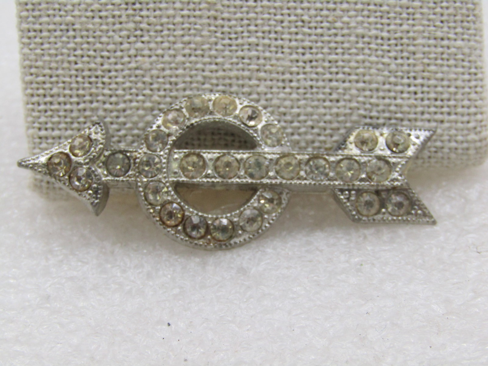 Vintage Art Deco Rhinestone Arrow Brooch, 1920's, C-Clasp, Signed Goody: Vintage Art Deco Rhinestone Arrow Brooch, 1920's, C-Clasp, Signed Goody and Pat. Pending. this is a 2" wide cast metal arrow with rhientones passing through a 3/4" circle, also with rhinestones. The r
