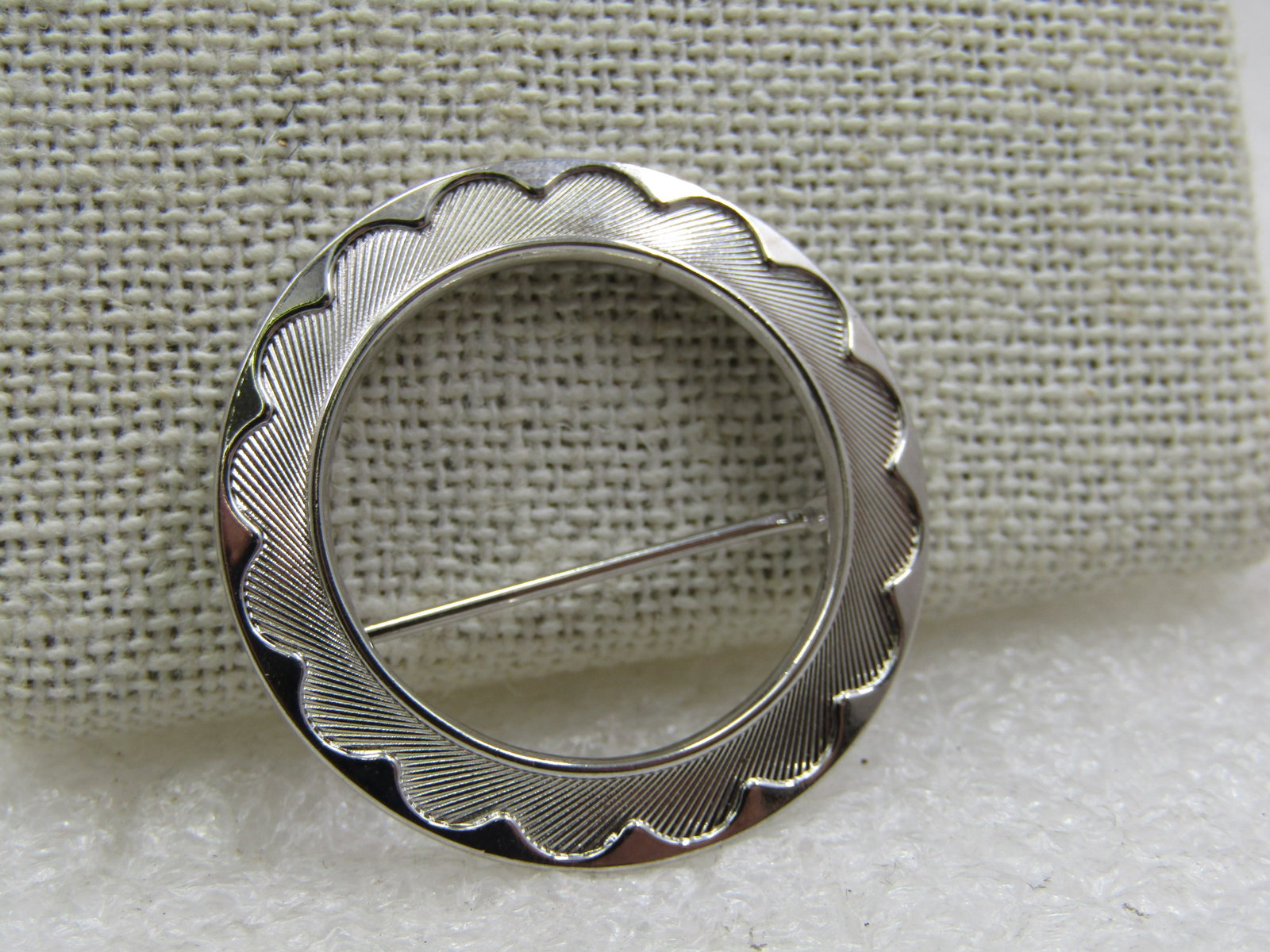 Vintage Scalloped Circle Brooch, 1.25", 1960's: Vintage Scalloped Circle Brooch, 1.25", 1960's. this has a ridged textured design with a scalloped look and a raised and shiny and smoother outer edge. It is silver tone metal with locking clasp. Not 
