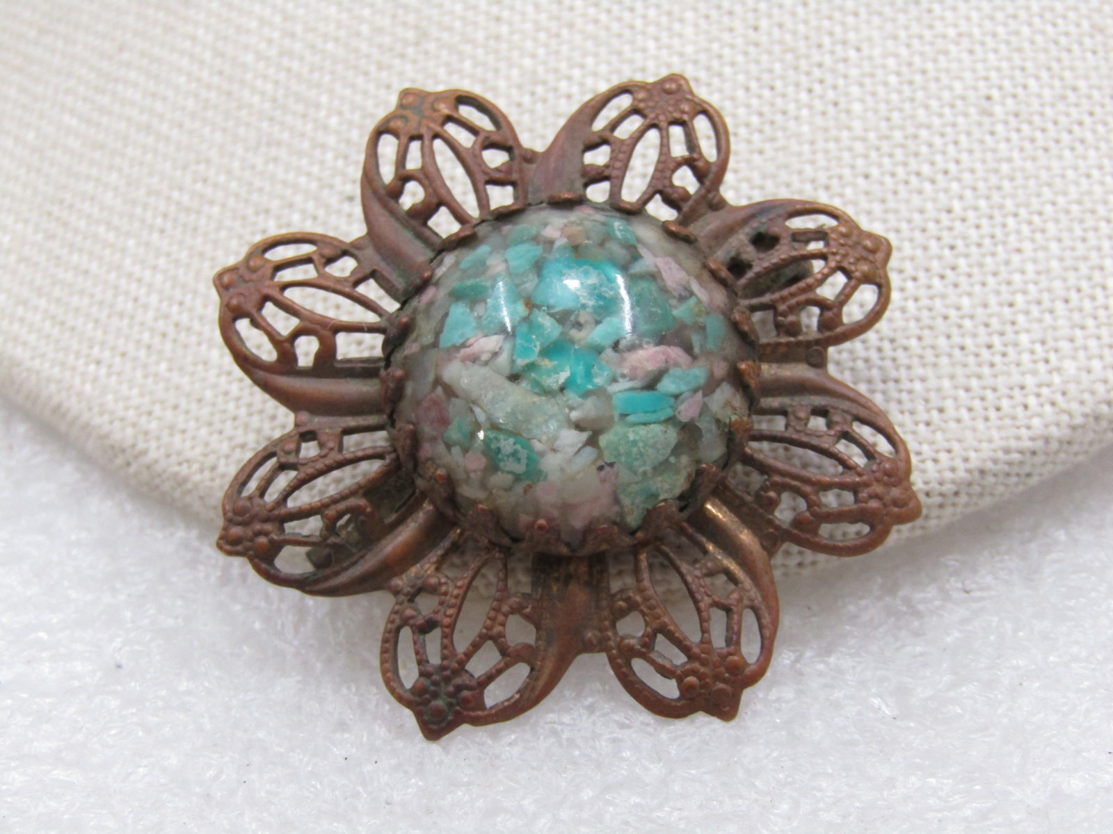 Vintage Early Turquoise & Agate Chips Filigree Brooch, Early 1900's, 1.75": Vintage Early Turquoise & Agate Chips Filigree Brooch, Early 1900's, 1.75". This has a blossom design with a center stone that is turquoise chips colored or real, unknown, as well as some stones set i