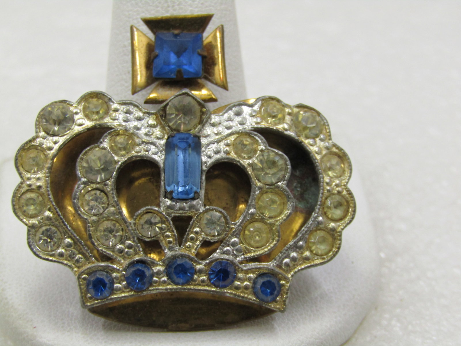 Vintage Blue & Clear Rhinestone Crown Brooch, Maltese Cross, 1.75" tall and wide.: Vintage Blue & Clear Rhinestone Crown Brooch, Maltese Cross, 1.75" tall and wide. Two-tone. Silver tone front and gold tone back. This has blue round rhinestones at the base and inside the cross with 
