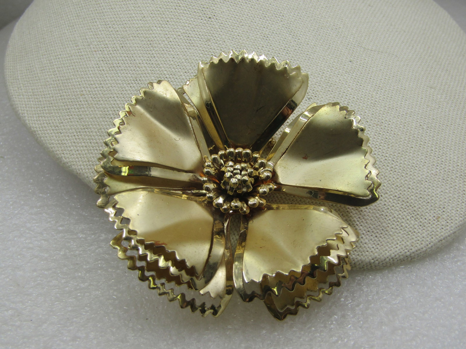 Vintage Tiered Large Blossom Brooch, 1960's, 2-7/8": Vintage Tiered Large Blossom Brooch, 1960's, 2-7/8" This has pointed cut petals that are in stacked tiers of five petals around the brooch with a recessed center. Satin and smooth finish. Not signed b