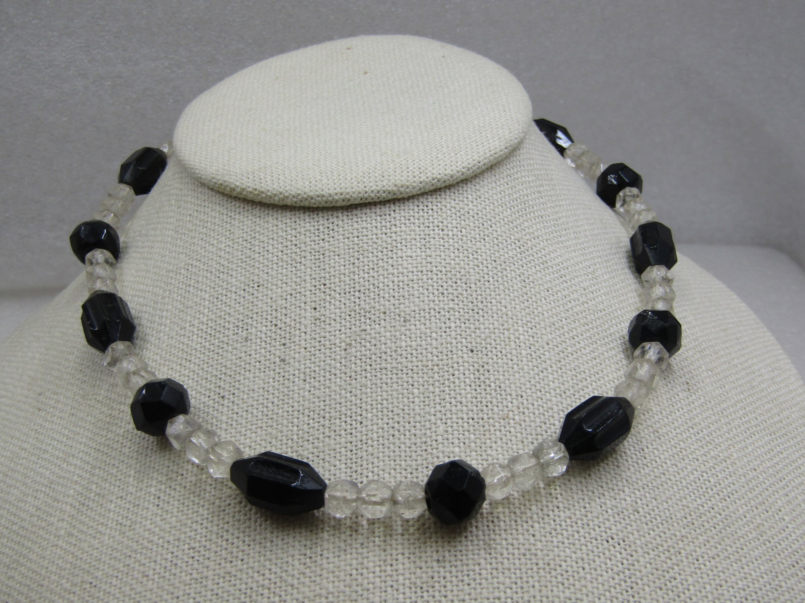 Vintage Clear & Black Glass Beaded Necklace, 15.5", 1940's: Vintage Clear & Black Glass Beaded Necklace, 15.5", 1940's or earlier. Clear faceted beads that are appx. 5.5mm with black round and ridged long beads. The round black beads are appx. 9.5mm round and
