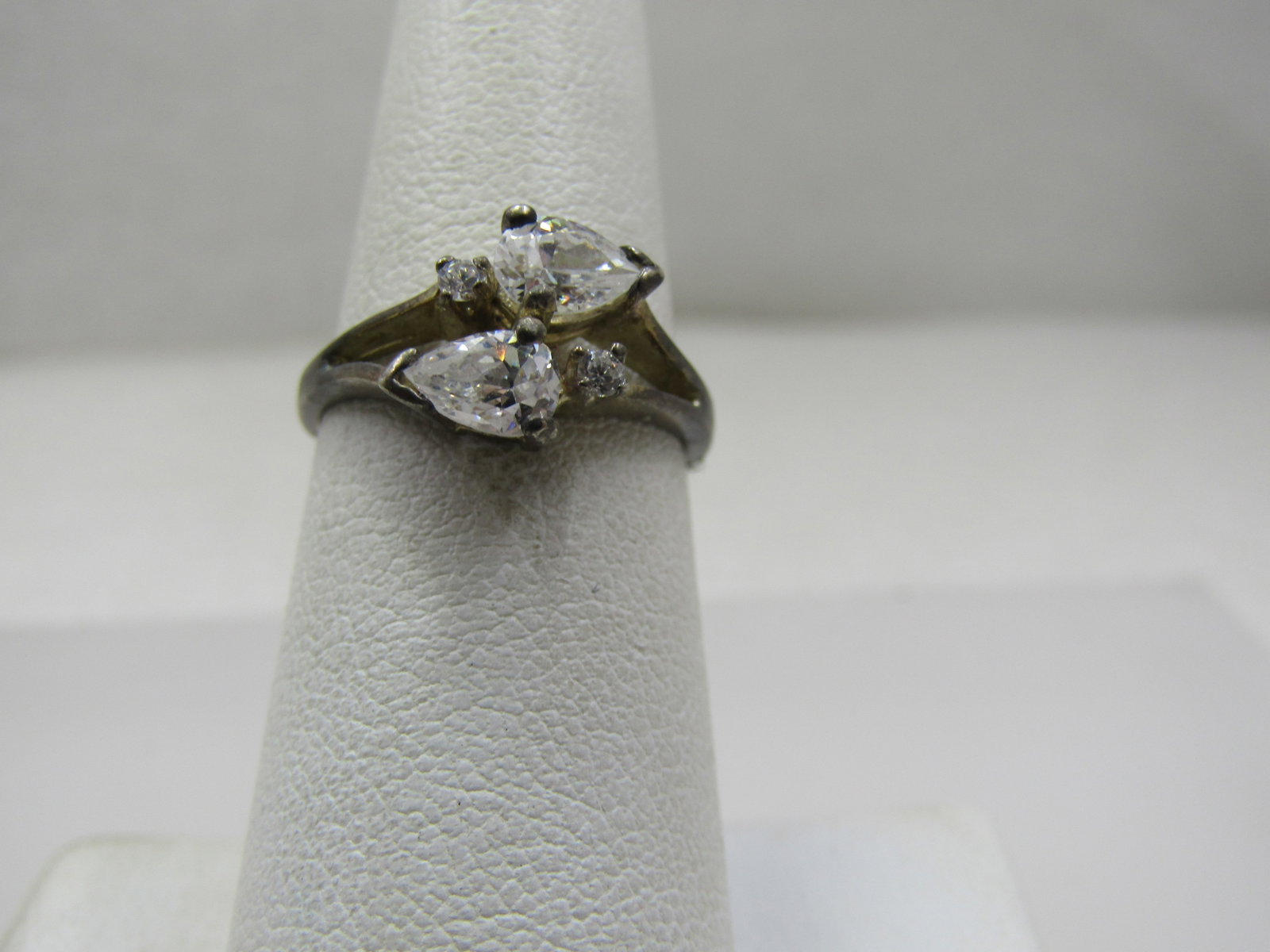Vintage Sterling Bypass Clear CZ Ring, Sz. 6.5: Vintage Sterling Bypass Clear CZ Ring, Sz. 6.5. This has a pear shaped cz and round on each side of the bypass. The pear shaped stone is appx. 5mm by 3.5mm and the round is appx. 1.5mm. It has a