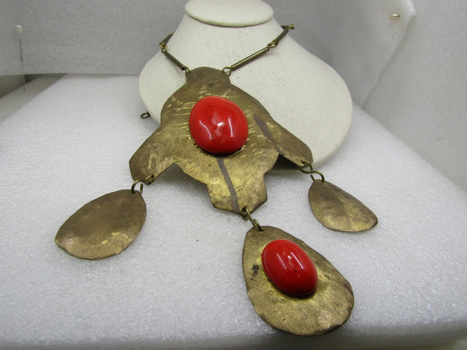 Vintage Rustic Brass Statement Necklace with Paprika Toned Cabochons, 30": Vintage Rustic Brass Statement Necklace with Paprika Toned Cabochons, 30" long bar chain and an 8" hammed and distressed rustic pendant that has three dangles, teardrop with a center parika colored ca