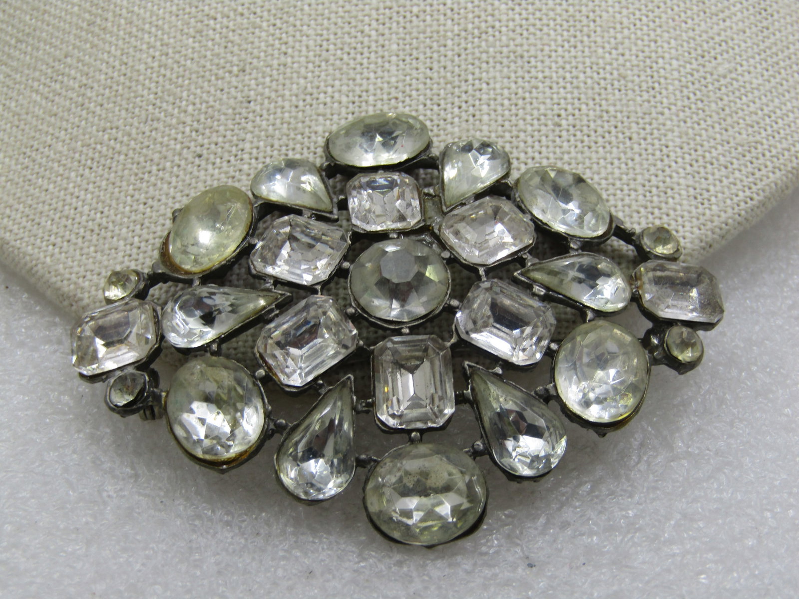 Vintage Clear Rhinestone Brooch, 1920's, 3" by 2.25": Vintage Clear Rhinestone Brooch, 1920's, 3" by 2.25" with large clear glass rhienstoens that are appx. 11mm to 12mm and in a variety of cuts - oval, round, pear, princess cut with smaller appx. 4mm