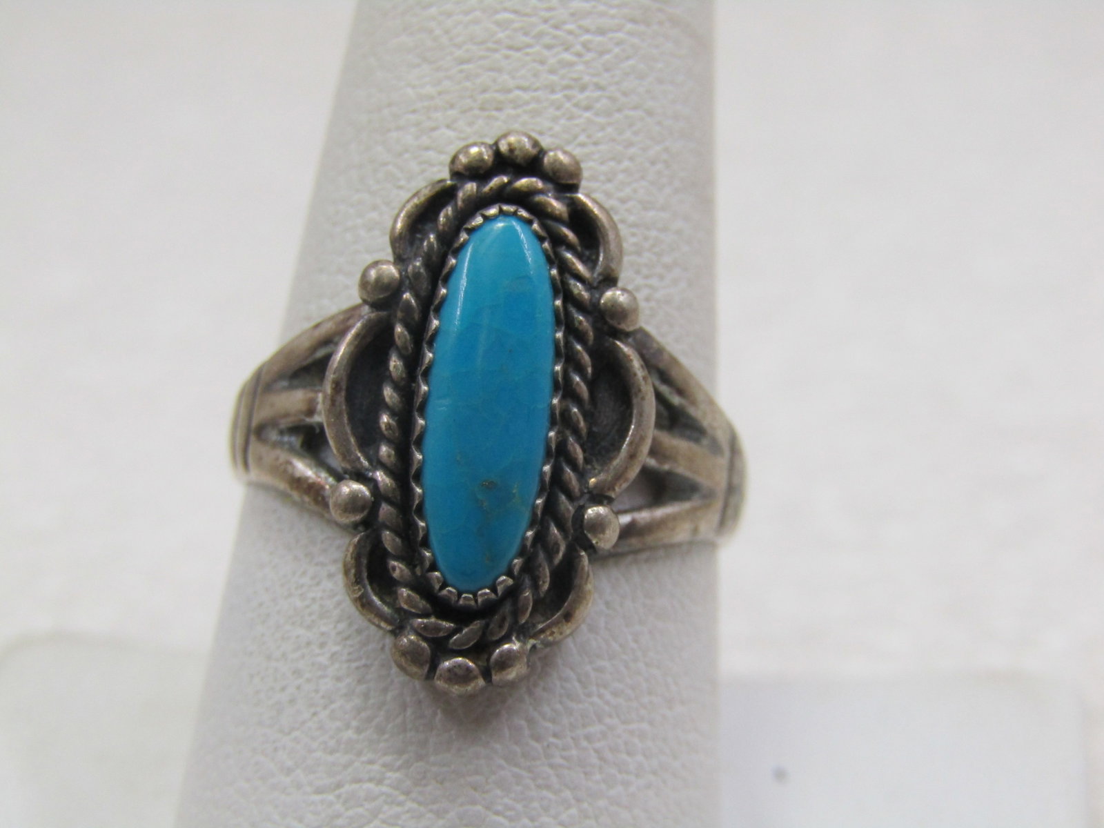 Vintage Sterling Southwestern Turquoise Ring, Sz. 9. 1960'-1970's, Signed: Vintage Sterling Southwestern Turquoise Ring, Sz. 9. 1960'-1970's, Signed with an unknown mark - may have a W in it but cannot read. Weight is appx. 5.44 grams. Sawtooth bezel-set stone that is appx. 