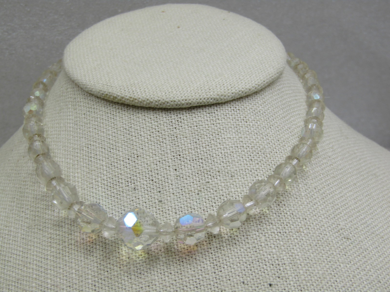 Vntage Aurora Borealis Crystal Beaded Necklace, 15.5", 1940's: Vntage Crystal Beaded Necklace, 15.5", 1940's. Graduated aurora borealis round faceted beads that range from 4.5mm to 11mm with clear faceted diamond shaped between between. Hook clasp. It is not mark