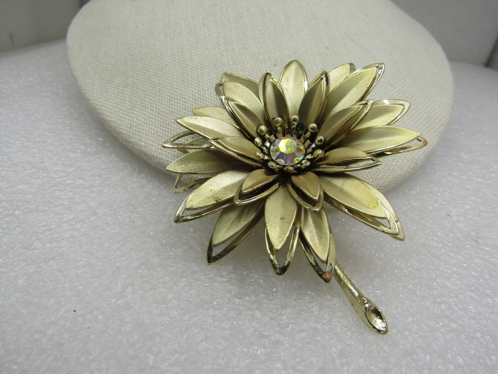 Vintage Large Floral Brooch, A.B. Rhienstone, 3.5", 1960's: Vintage Large Floral Brooch, A.B. Rhienstone, 3.5", tall and 2.5" wide. It has thre tieres of shiny and satiny petals with a center 7mm round aurora borealis rhinestone. 1960's. It is not signed or ma