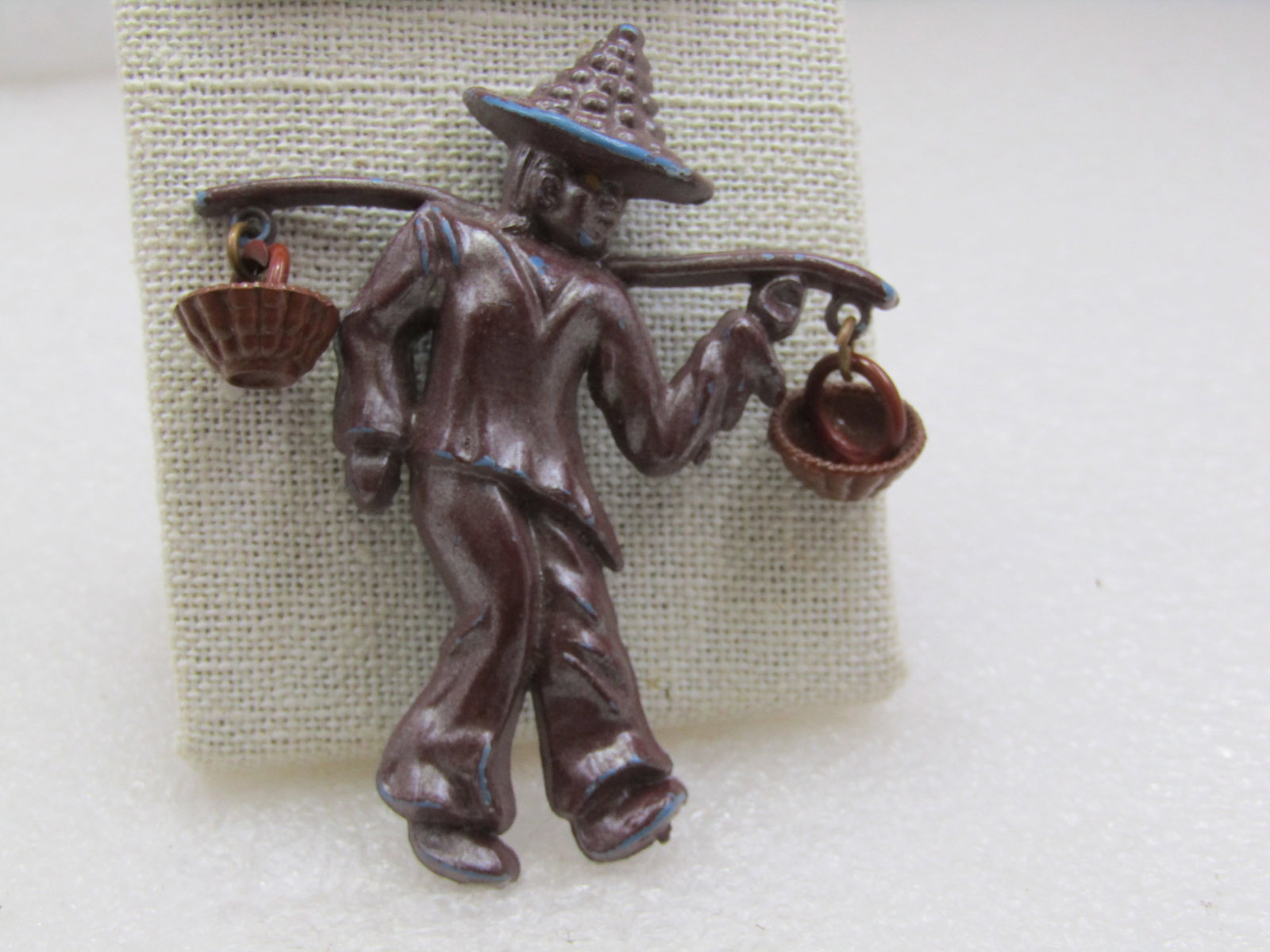 Vintage Chinese Basket Carrier Brooch, 2.75" Tall, by 2.25, Mid-Century: Vintage Chinese Basket Carrier Brooch, 2.75" Tall, by 2.25, Mid-Century. this is a plastic brooch with a Chinese person carrying two basket that dangle from a stick across his shoulders. Molded