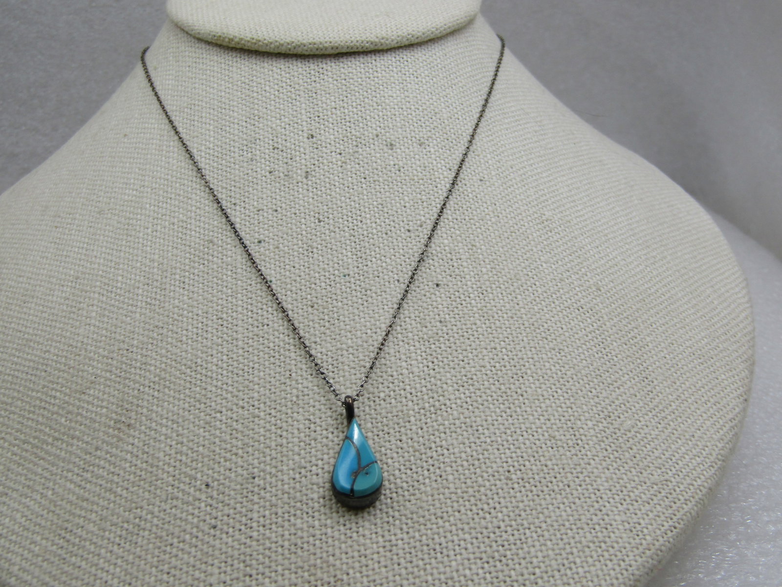Vintage Sterilng Southwestern Inlaid Turquoise Necklace, 16": Vintage Sterilng Southwestern Inlaid Turquoise Necklace, 16". Teardrop shaped inlaid thurquoise pendant with three sections. The pendant with bail is appx. 3/4" long and it is slightly under 1/2" at t