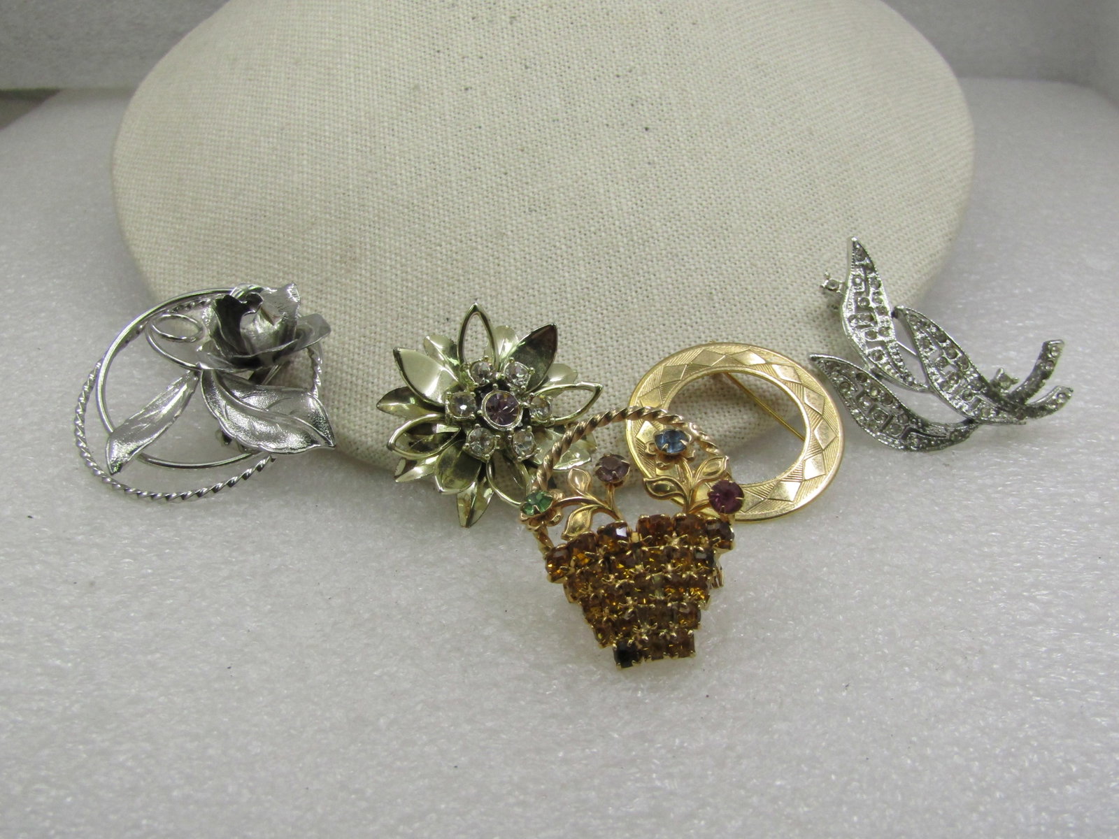 Vintage 4 Brooch, 1 Earring Lot, Rhinestones & Circle, 1950's-1960's: Vintage 4 Brooch, 1 Earring Lot, Rhinestones & Circle, 1950's-1960's. A gold tone 1.25" round circle brooch with etched design on top with textured and diamond shaped desings, not signed by the maker.