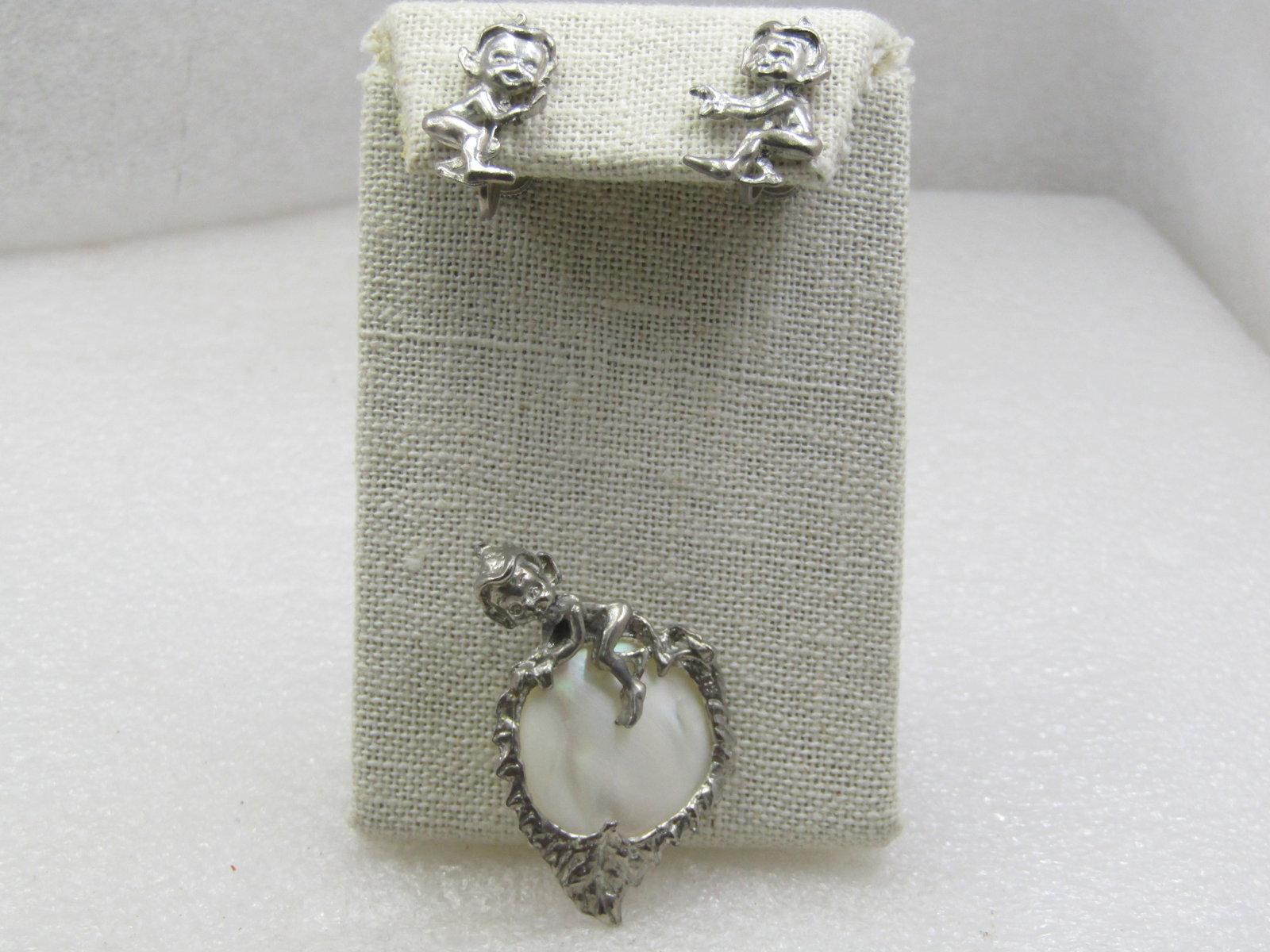 Vintage Mother of Pearl Pixie Brooch & Clip Earrings Set, Mid-Century: Vintage Mother of Pearl Pixie Brooch & Clip Earrings Set, Mid-Century. Also called Cyvra elves these little imps are very cute with their pointed caps. The brooch has an elf on top of a faux mother-of