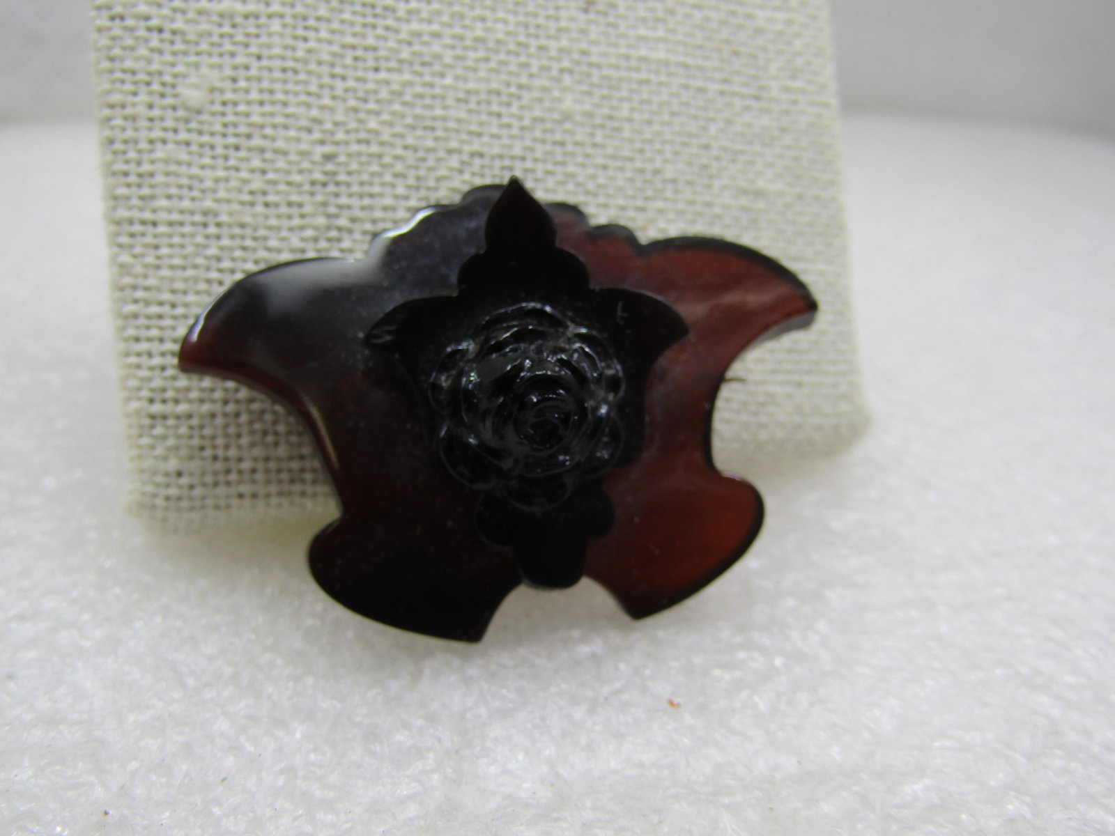 Vintage Faux Tortoiseshell Tiered Brooch with Rose, C-Clasp, 1.75": Vintage Faux Tortoiseshell Tiered Brooch with Rose, C-Clasp, 1.75" wide and appx. 1.25" tall. It has a fanned and background pieces that a a cut design like a fleur-de-lis sits on with a molded rose