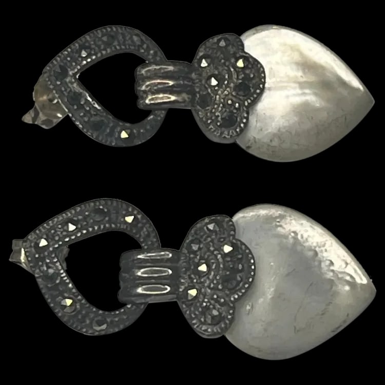 Vintage Sterling Silver Marcasite and Moonstone Heart EarringsSterling SilverWeighs 8.5: Vintage Sterling Silver Marcasite and Moonstone Heart EarringsSterling SilverWeighs 8.5 gramsMeasures .05 x 1.25 inches Vintage Sterling Silver Weighs 8.5 gramsMeasures .05 x 1.25 inches Reserve: $35.