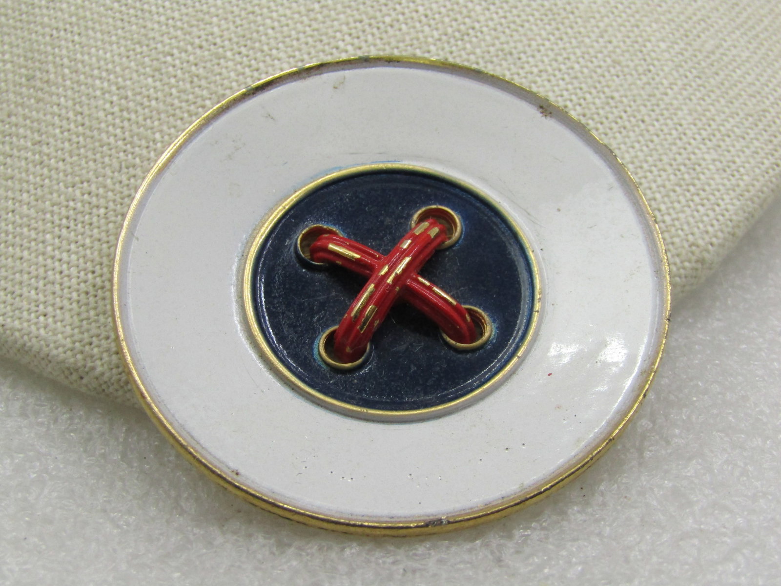 Vintage Red, White, Blue Enameled Button Brooch, 2/25": Vintage Red, White, Blue Enameled Button Brooch, 2.25" across with slightly recessed center. Gold tone. Age is estimated at 1960's. Good to very good condition. Some light wear on the red enameling.