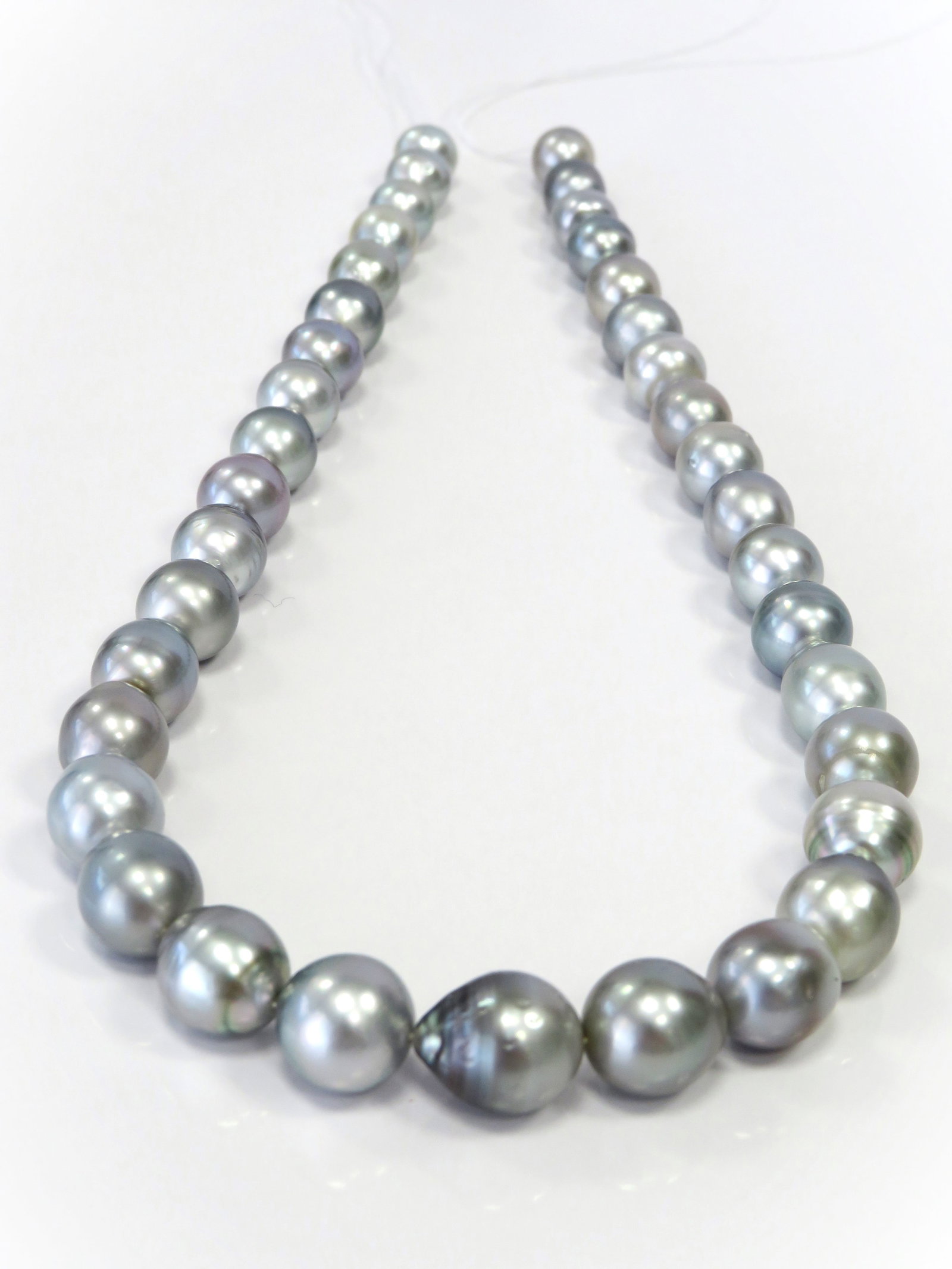 9-11mm Drop/Oval Silver-Blue Tahitian Pearl Necklace Strand: Title: 9-11mm Drop/Oval Silver-Blue Tahitian Pearl Necklace Strand Description:A-Grade High luster, Drop-Oval Silver-Blue, with minimal spots/blemishes, 37 pearl pieces, 18 inches long hand-knotted