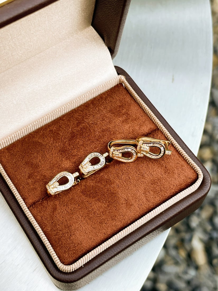 A pair of 18K gold diamond earrings. - 4