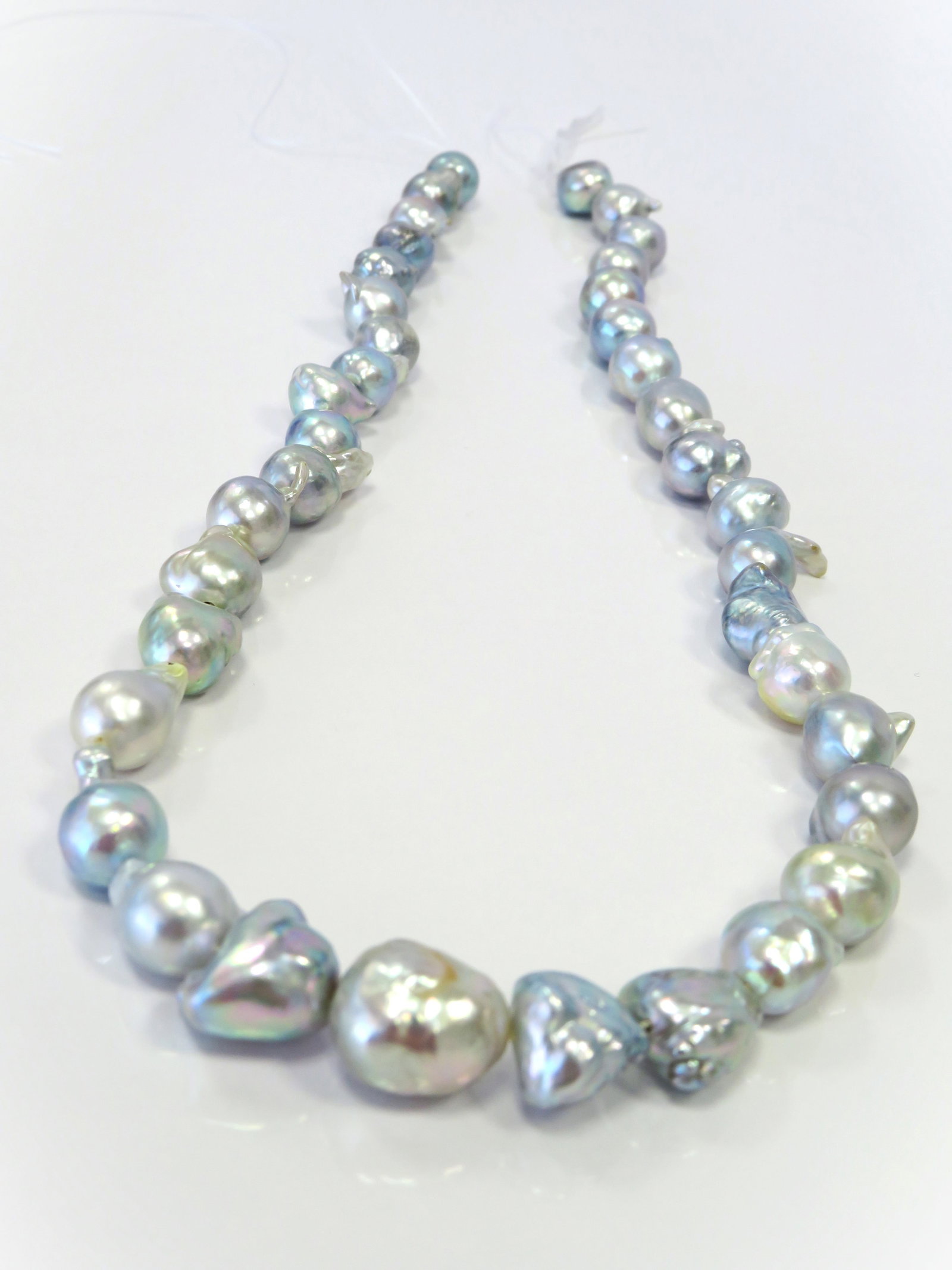 8-12mm Mix Drop-Baroque Blue/White Akoya Pearl Necklace Strand: Title: 8-12mm Mix Drop-Baroque Blue/White Akoya Pearl Necklace Strand Description:A-AA Grade High luster, Irridescent White/Blue Drop-Baroque/Free-form with minimal spots/blemishes, 38 pearl pieces,