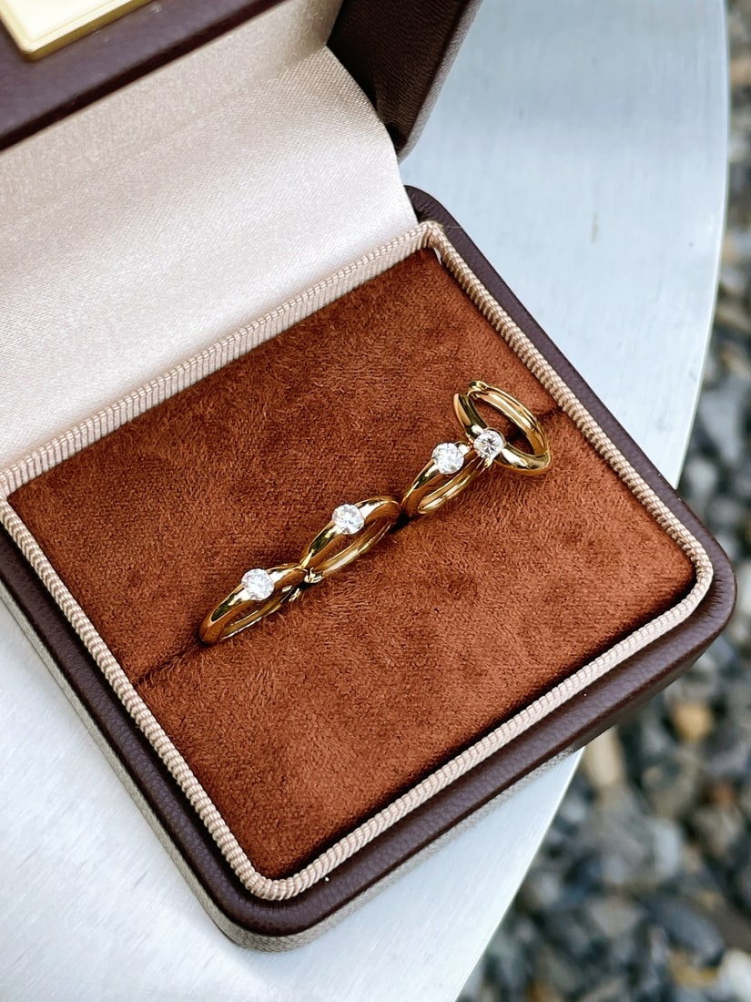 A pair of 18K gold diamond earrings. - 4
