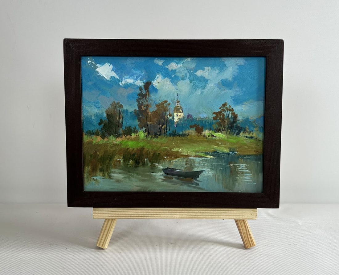 Oil painting A lonely boat among the reeds Yuriy Suprunchuk: NoAAA4344The painting "A Lonely Boat Among the Reeds" captures a serene yet slightly melancholic landscape where nature and human presence exist in quiet harmony. With expressive brushstrokes and a ba