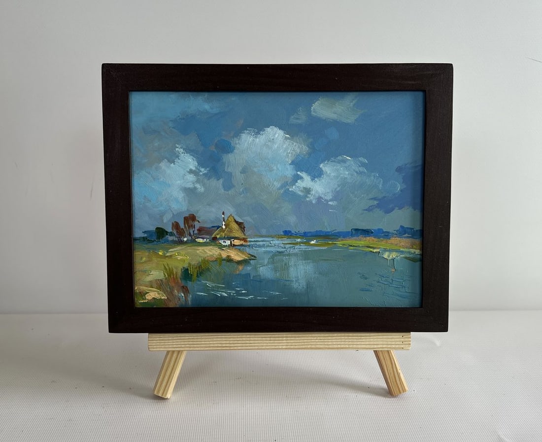Oil painting Summer flood of the river Yuriy Suprunchuk: NoAAA4352The painting "Summer Flood of the River" masterfully captures a tranquil rural landscape where nature and human presence coexist in harmony. Created using oil on cardboard, the piece conveys 