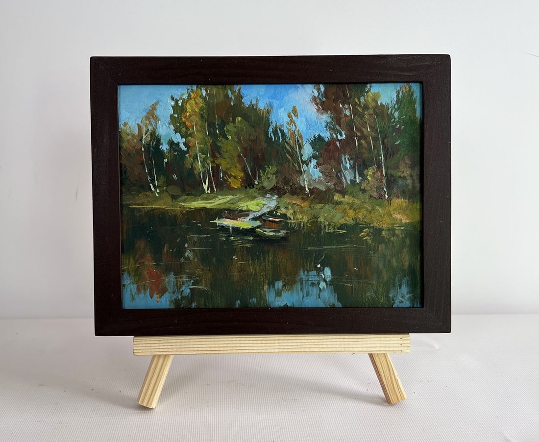 Oil painting Flowing among the trees Yuriy Suprunchuk: NoAAA4358The painting "Flowing Among the Trees" beautifully captures the serenity of nature, where water and woodland blend harmoniously. The composition is centered around a peaceful river or lake, s