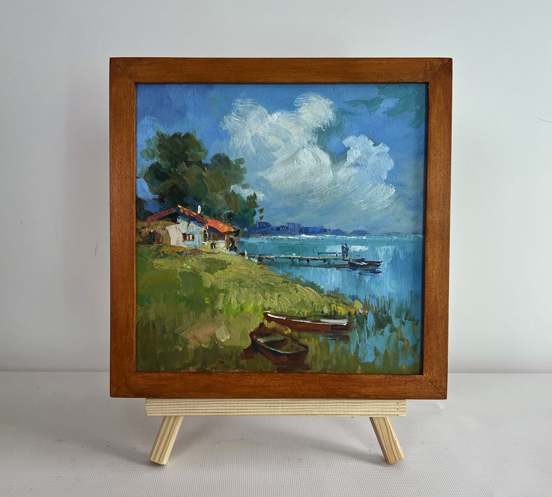 Oil painting House near the river Yuriy Suprunchuk: NoAAA4359The painting "House Near the River" captures a peaceful and idyllic riverside scene, where nature and human presence harmoniously coexist. The composition is beautifully structured, drawing t