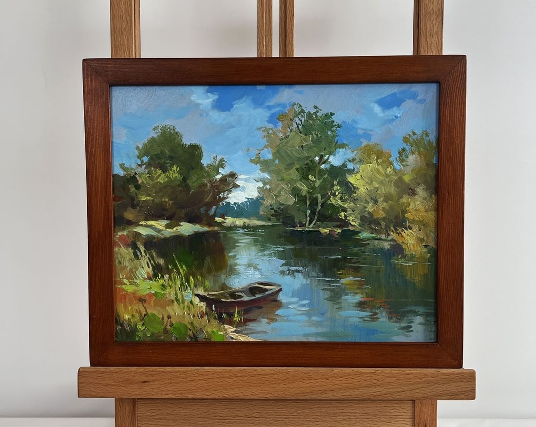 Oil painting Boat in green reflections Yuriy Suprunchuk: NoAAA4387The painting "Boat in Green Reflections" beautifully captures a serene riverside scene, where nature and tranquility intertwine in perfect harmony. The composition is filled with vibrant gree