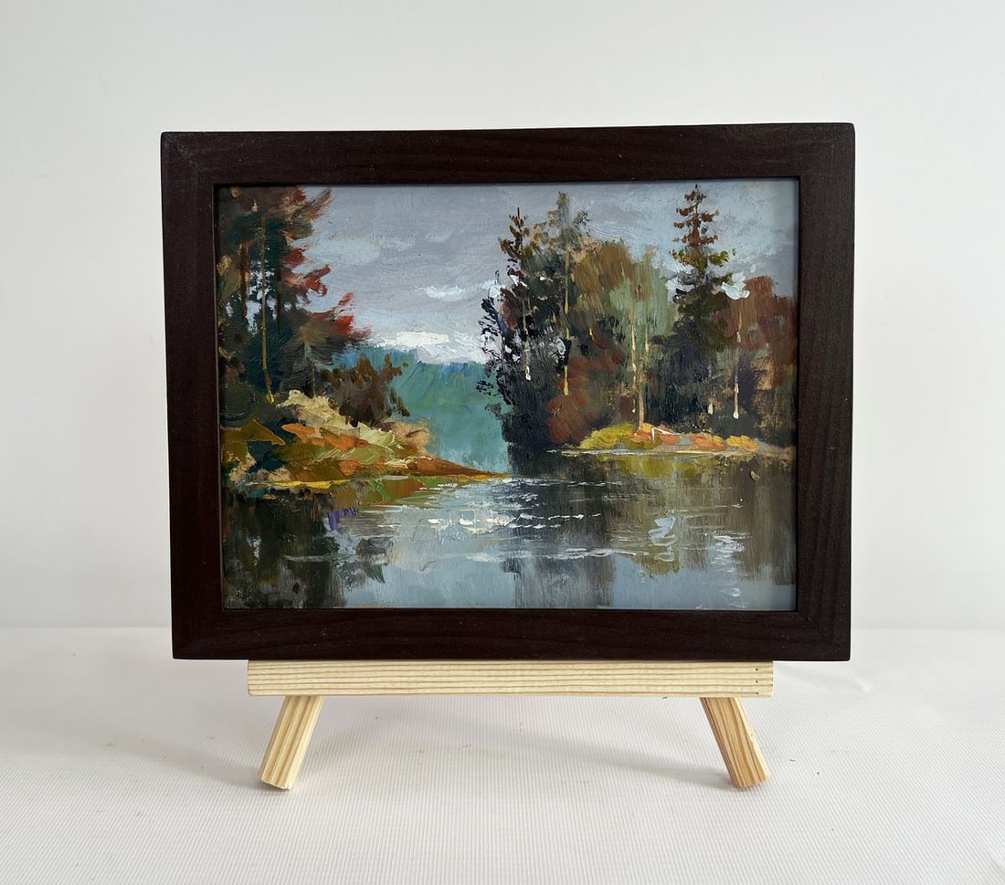 Oil painting A river washes through the autumn forest Yuriy Suprunchuk: NoAAA4397The painting "A River Washes Through the Autumn Forest" presents a mesmerizing scene of untouched wilderness, where nature is immersed in the colors and serenity of autumn. The composition dr