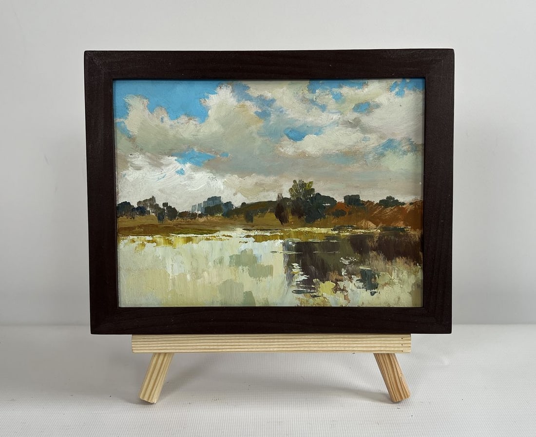 Oil painting The flow of time and nature Yuriy Suprunchuk: NoAAA4410The painting "The Flow of Time and Nature" captures a serene and reflective moment in the natural world, where the stillness of the landscape meets the ever-changing sky. The composition is