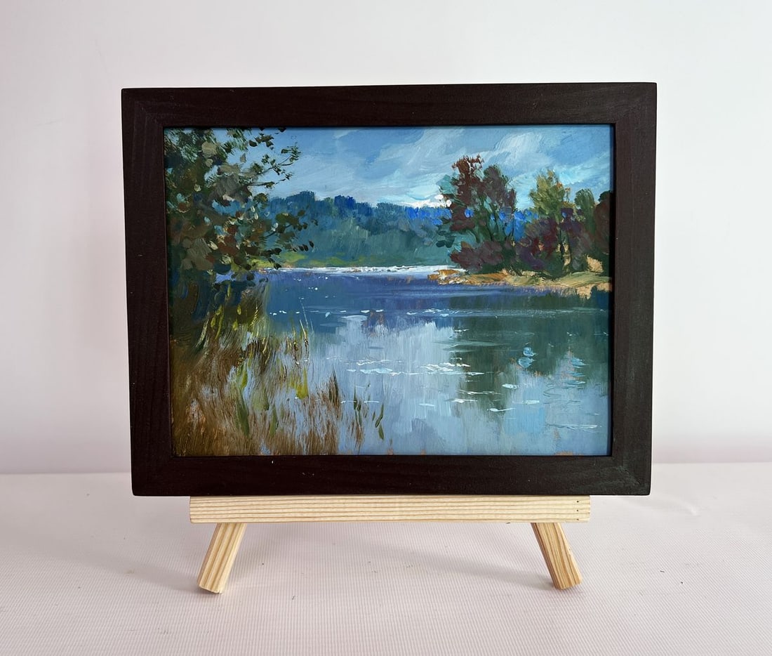 Oil painting By the evening in nature Yuriy Suprunchuk: NoAAA4430The painting "By the Evening in Nature" captures the serene beauty of a quiet riverside as dusk approaches. The scene is bathed in the soft, diffused light of the setting sun, which casts a d