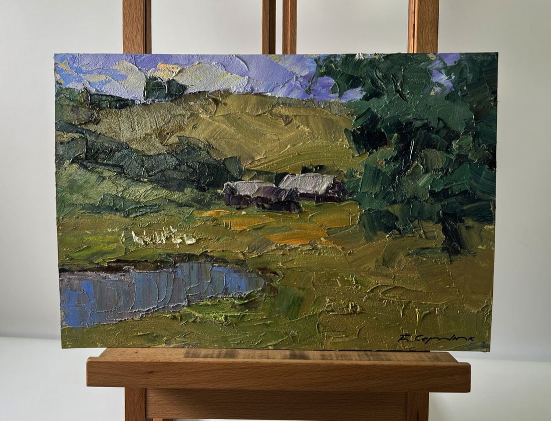 Oil painting Mountainous terrain Boris Serdyuk: NoAAA5724The Oil painting Cardboard titled "Mountainous terrain" presents a serene landscape where the grandeur of nature meets the simplicity of rural life. The artist uses a textured impasto techniq