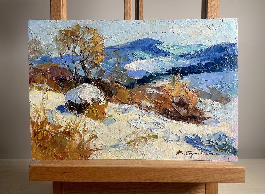 Oil painting Winter mountains Boris Serdyuk: NoAAA3713The painting "Winter Mountains" captures the serene beauty of a snow-covered mountain landscape, where rolling hills and rugged terrain stretch into the distance. The artist uses expressive, 