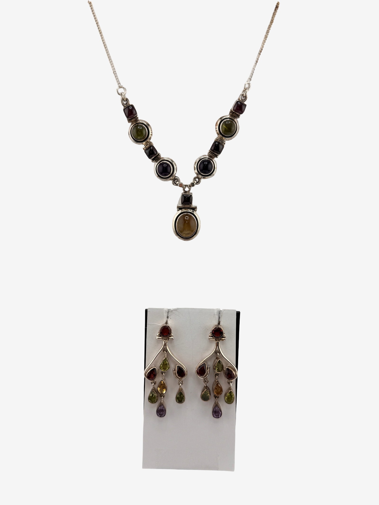 Sterling Silver Multi-Gemstone Necklace and Earring Suite 28.52g (incl. stones): A lovely suite of sterling silver jewelry featuring a necklace and matching dangle earrings. The necklace is designed with a series of bezel-set, cabochon-cut gemstones in various colors including