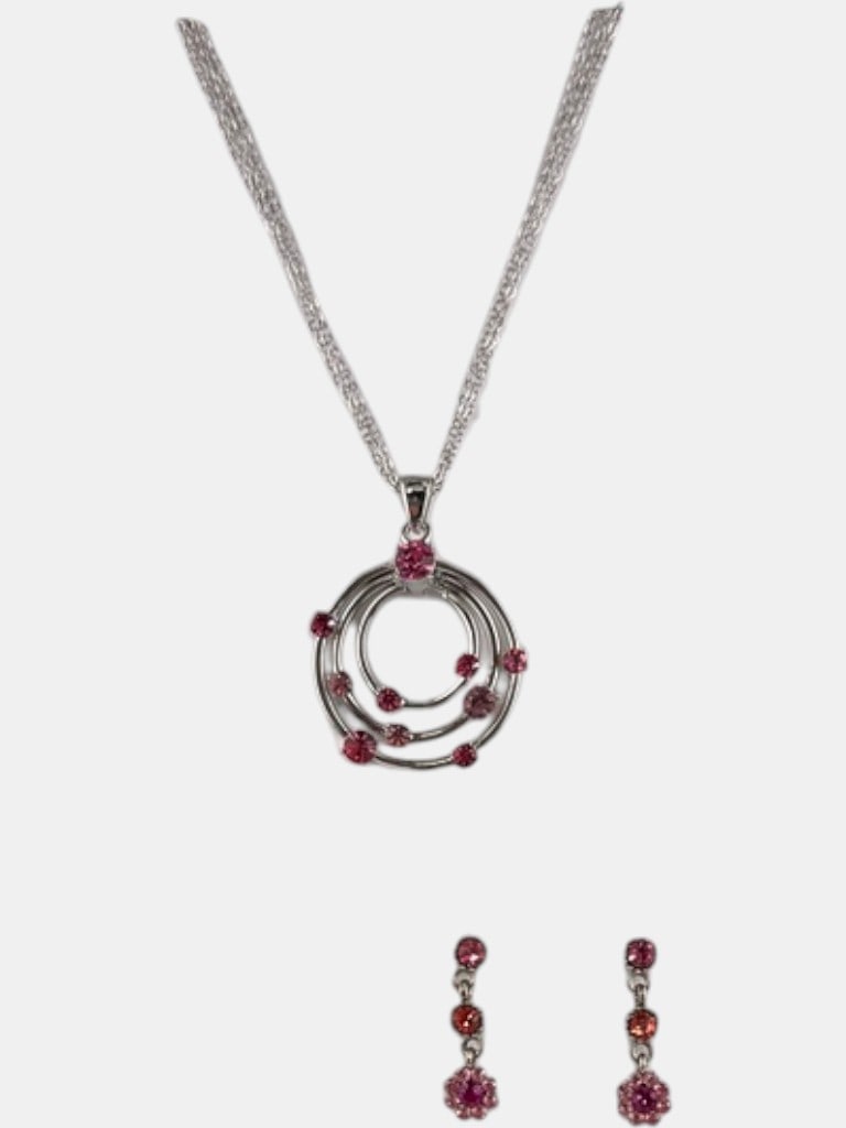Pink Gemstone Silver Tone Necklace and Earring Set: A contemporary necklace and earring set featuring pink gemstones and silver tone metal. The pendant is comprised of three concentric rings, diminishing in size, with various sized pink gemstones