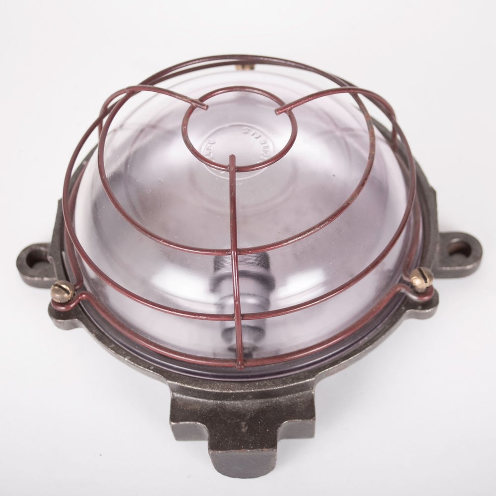FRENCH INDUSTRIAL MODERNIST HUBLOT FACTORY: French modernist lamp made in the 1950's . It is designed to be outside or outside , it could be a cool desk lamp or just for atmosphere monted on a wall .While it has been cleaned I left its original
