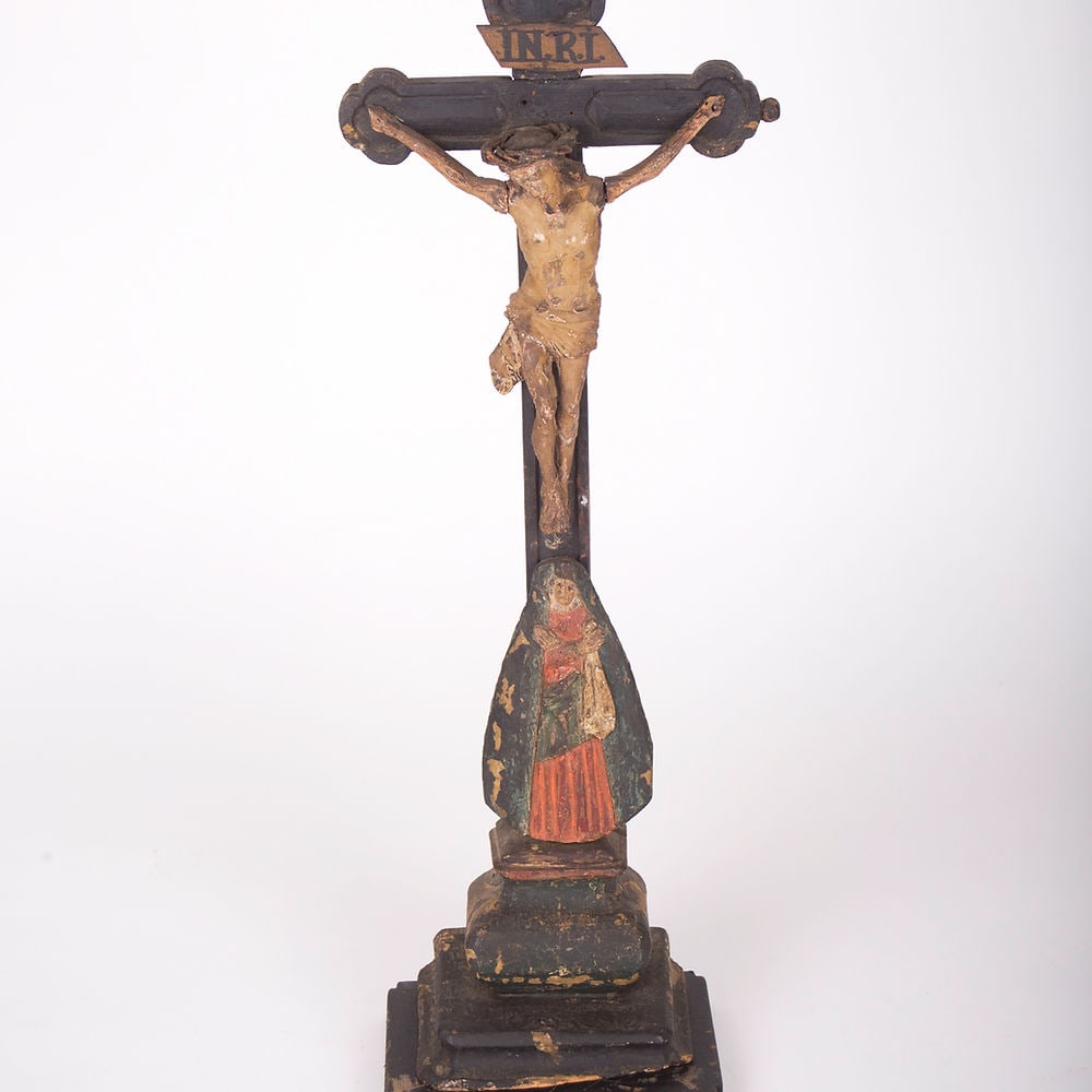 French early 18th Century Carved And Painted Wooden Crucifix: An early 18th Century antique hand carved and polychromed hand painted table crucifix from France with its original patina preserved. It depicts Christ on the cross with a crown of thorns with the Vir