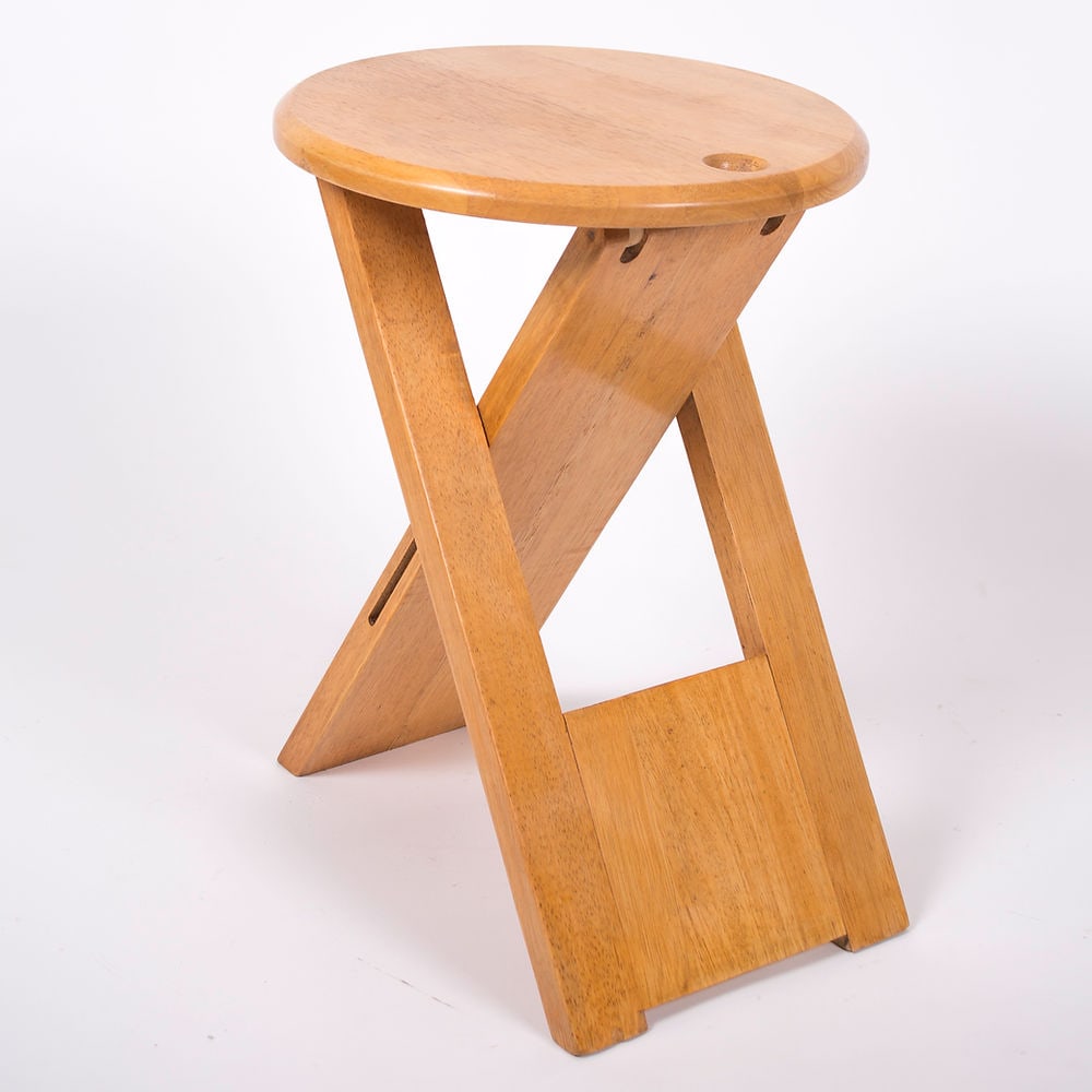 Mid century pine folding stools by Roger Talon: Roger Talon pine folding stools are a great choice for anyone looking for a practical and stylish piece of furniture that can serve multiple functions in their home.The fact that they can be folded an
