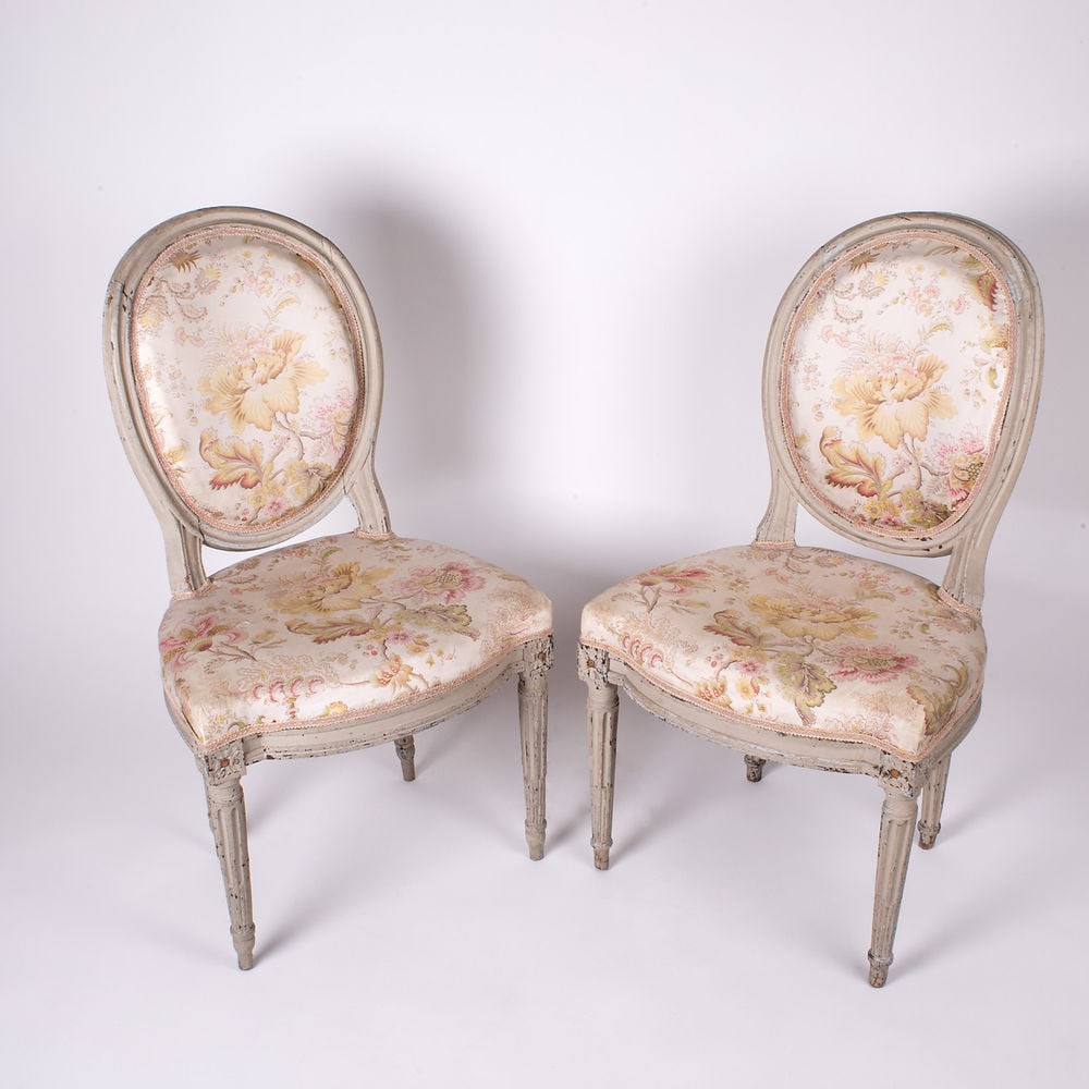Louis XVI bedroom Chairs neo classic 18th: Charming 18th century bedroom chair in a sober and graceful style indicative of this era of political transition . The frame hand carved is painted with " grisaille " manner of the late 18th. The glaz