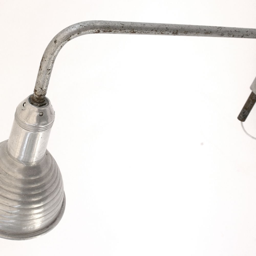 FRENCH INDUSTRIAL ART DECO MODERNIST SWINGING TASK LAMP: French modernist lamp made in the 1930's or earlier .It is a swinging type which was used in a garage or in a industrial setting .While it has been cleaned I left its original patina; Size L.22 x glob