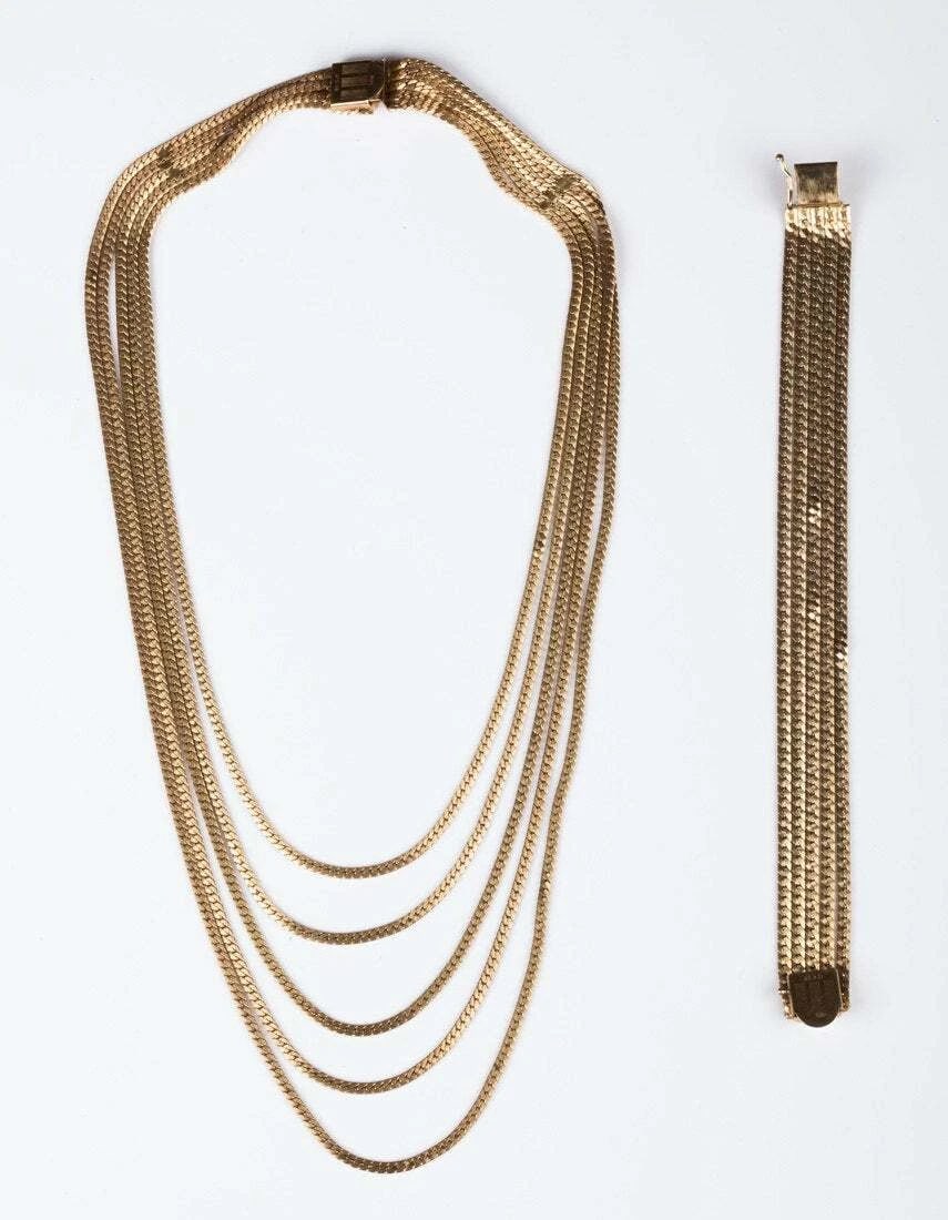 12 kt Gold Filled Chain Necklace and Bracelet Set: Title:12 kt Gold Filled Chain Necklace and Bracelet Set Description:Gorgeous matching set of necklace and bracelet. Circa 1940's. Necklace is five strands of chain that measures 18” long.
