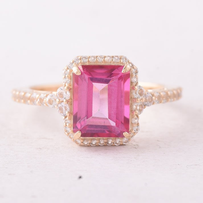 3.49 Ct Octagon Pink Topaz 9K Gold Ring: 3.49 Total Carat Pink Topaz 9K Gold Ring Specifications: Total Weight 2.768 g Center Gemstone Pink Topaz Gemstone Carat Weight 2.91 Carats Gemstone Measurements 9.20X7.30X4.70 mm Additional Gemstones