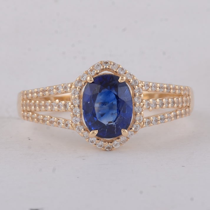 1.81 Ct Oval Sapphire 9K Gold Ring: 1.81 Total Carat Sapphire 9K Gold Ring Specifications: Total Weight 2.58 g Center Gemstone Sapphire Gemstone Carat Weight 1.49 Carats Gemstone Measurements 7.40X5.80X3.60 mm Additional Gemstones