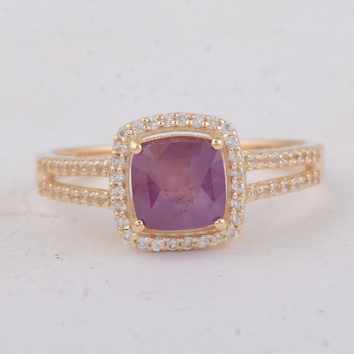 2.15 Ct Cushion Fancy Sapphire 9K Gold Ring: 2.15 Total Carat Fancy Sapphire 9K Gold Ring Specifications: Total Weight 2.41 g Center Gemstone Fancy Sapphire Gemstone Carat Weight 1.9 Carats Gemstone Measurements 6.20X6X5 mm Additional Gemstones