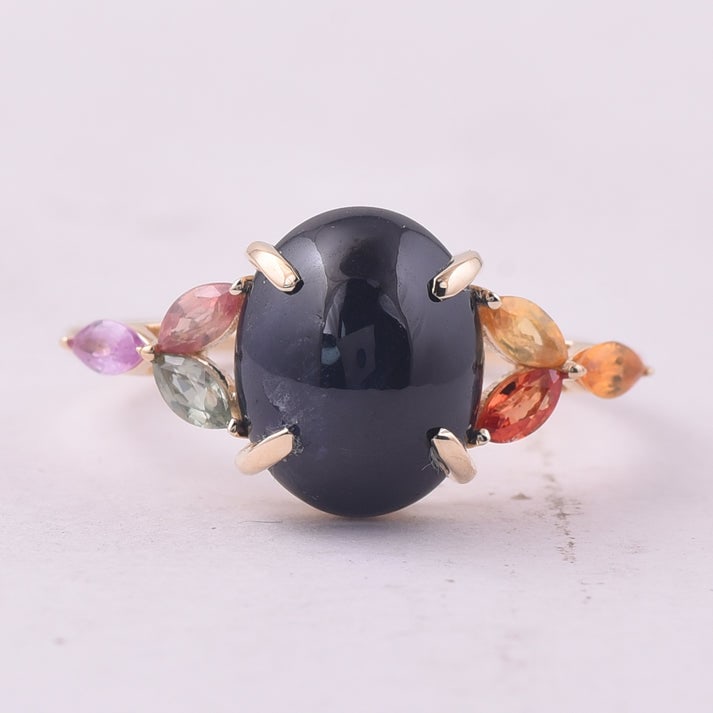 5.74 Ct Oval Sapphire 9K Gold Ring: 5.74 Total Carat Sapphire 9K Gold Ring Specifications: Total Weight 2.775 g Center Gemstone Sapphire Gemstone Carat Weight 5.12 Carats Gemstone Measurements 11X8.90X6.60 mm Additional Gemstones Multi