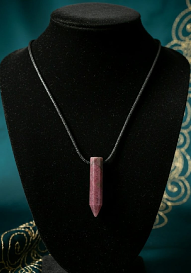 Rhodochrosite Pencil Pendant With Adjustable Black Cord: Title:Rhodochrosite Pencil Pendant With Adjustable Black Cord Description:Pendant DetailDesign : Pencil Pendant With Adjustable Black Cord Stone Name : RhodochrositeShape : Pencil,li>Dimensions:No Res