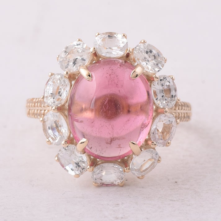 8.10 Ct Oval Tourmaline 9K Gold Ring: 8.10 Total Carat Tourmaline 9K Gold Ring Specifications: Total Weight 3.835 g Center Gemstone Tourmaline Gemstone Carat Weight 5.57 Carats Gemstone Measurements 12X10X5.70 mm Additional Gemstones Whit