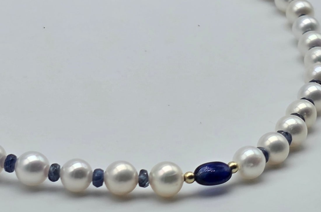 Akoya pearl necklace, 6.2 to 6.4 mm, with natural sapphire spacers, a central oval sapphire with - 4