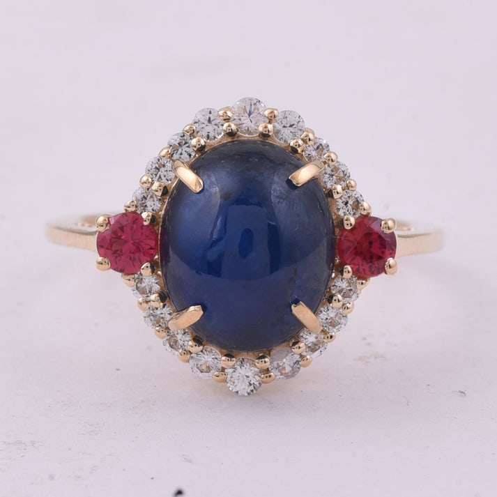 6.11 Ct Oval Sapphire 9K Gold Ring: 6.11 Total Carat Sapphire 9K Gold Ring Specifications: Total Weight 3.21 g Center Gemstone Sapphire Gemstone Carat Weight 5.3 Carats Gemstone Measurements 10.70X8.90X5.40 mm Additional Gemstones Multi