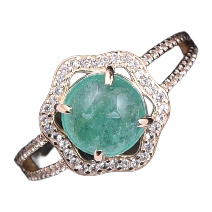 2.56 Ct Round Emerald 9K Gold Ring: 2.56 Total Carat Emerald 9K Gold Ring Specifications: Total Weight 2.208 g Center Gemstone Emerald Gemstone Carat Weight 2.22 Carats Gemstone Measurements 8 mm Additional Gemstones White Sapphire Addi